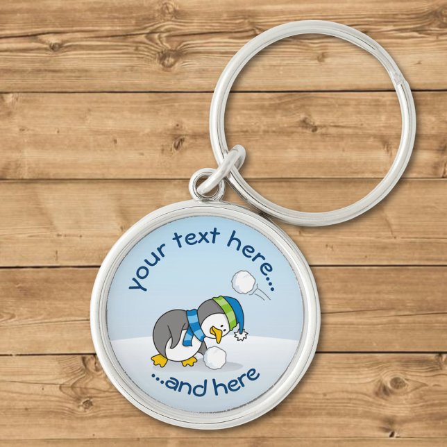 Chaveiro Pequeno pinguim pegando uma bola de neve (Criador carregado)