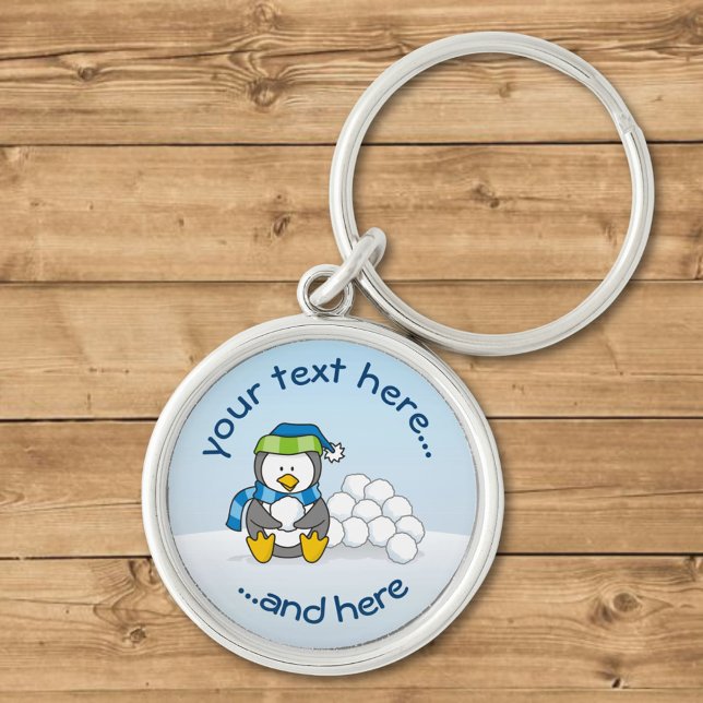 Chaveiro Pequeno pinguim sentado com bolas de neve (Criador carregado)