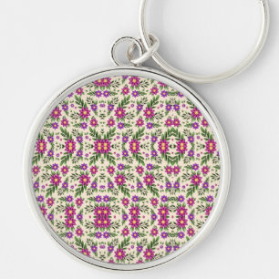 Chaveiro Pulseira redonda com um geométrico floral rosa e v