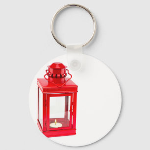 Chaveiro Red lantern with burning tealight on white