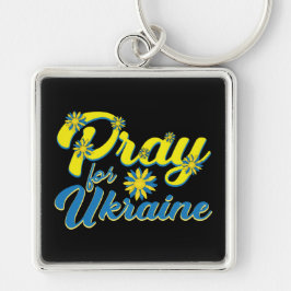 CHAVEIRO REZA NEGRA E AMARELO PARA A UCRÂNIA COM FLORES