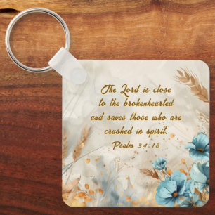 Chaveiro Salmo 34:18 O Senhor está perto de uma Bíblia de c