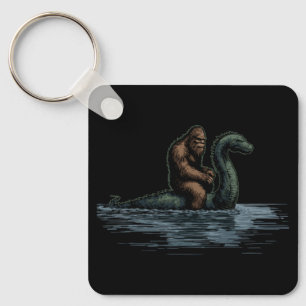 Chaveiro Sasquatch Bigfoot Cavalga o Monstro do Loch
