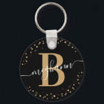 Chaveiro Script de Nome Dourado Negra Trendy Girly Black Mo<br><div class="desc">Rapariga, elegante, moderna, negra e dourada, chaveiro personalizado monograma com script de nome inicial monograma. Apresentando uma inicial de monograma e um script de nome feminino em uma fonte com letras maiúsculas de caligrafia e uma estrutura com círculo pontilhado ao redor do seu monograma. Presente feminino perfeito para irmã, mãe,...</div>