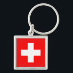 Chaveiro Sinalizador de suiça<br><div class="desc">A bandeira suíça é um quadrado com uma cruz no centro. As cores usadas na bandeira são vermelho, branco. A proporção do pavilhão suíço é de 1:1. A bandeira da Suiça foi adotada em 1889. O primeiro uso do atual design de bandeira foi em 1470. A última mudança para o...</div>