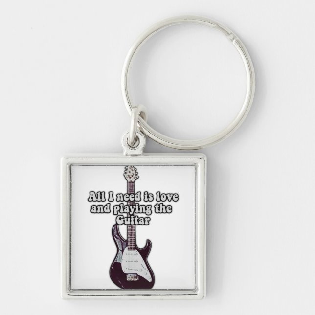 Chaveiro Só preciso de amor e de tocar violão. (Frente)