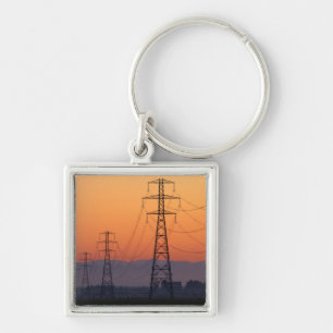 Chaveiro Torres de Energia ao Pôr do Sol