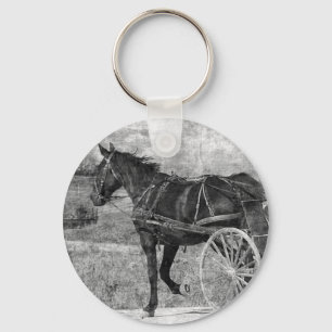 Chaveiro Trote longe do cavalo de Amish a preto e branco