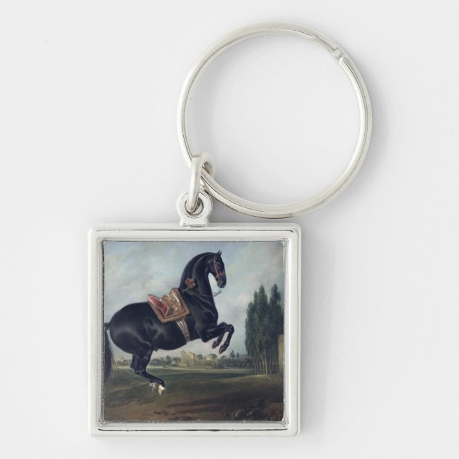 Chaveiro Um cavalo preto que executa o Courbette (Frente)