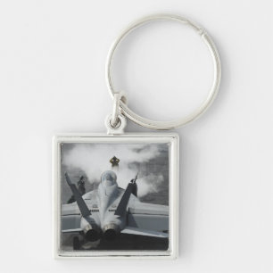 Chaveiro Um diretor da plataforma de vôo sinaliza um