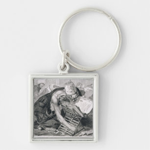 Chaveiro Um homem instruído absorvido no Koran