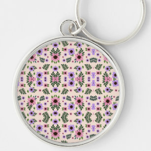 Chaveiro Uma pulseira de chave redonda com um floral vibran