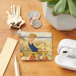 Chaveiro Vintage Boy tocando na praia com Sand Toys