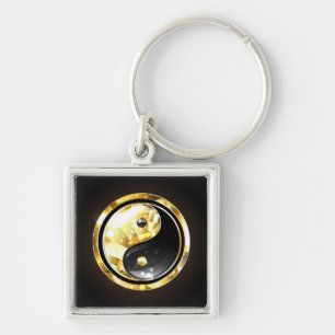 Chaveiro Yin Yang dourado em preto
