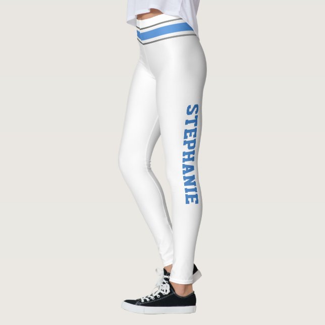Cheerleaderes brancos e azuis personalizam legging (Esquerda)