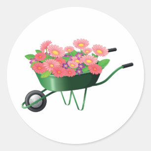 Cheio do carrinho de mão de etiquetas das flores