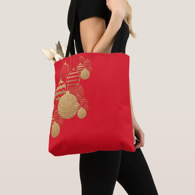 Christmas tote bag with baubles on red background (Close Up)
