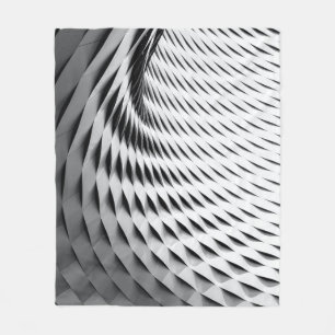 Cobertor De Velo A curved facade covered in white latticework
