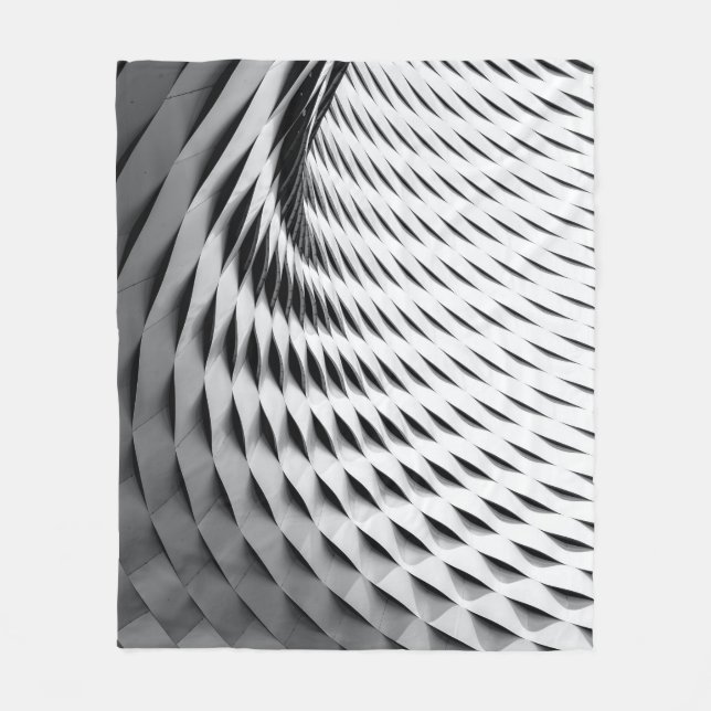 Cobertor De Velo A curved facade covered in white latticework (Frente)