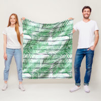 Folhas de palma num fundo branco e preto listrado