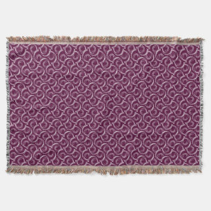 Cobertor Ornamento branco em um fundo burgundy.