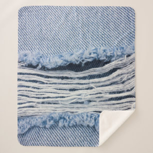 Cobertor Sherpa A textura de Jeans rasgados azul-claro .