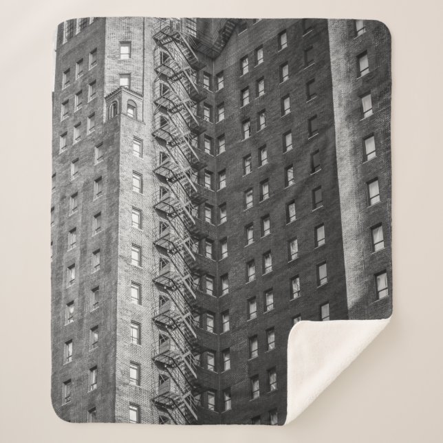 COBERTOR SHERPA EDIFÍCIOS CONCRETOS DE CINZAS E NEGROS (Frente)