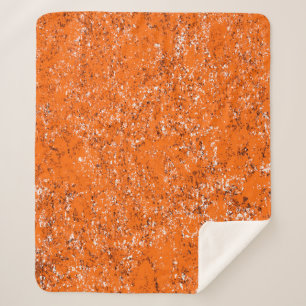 Cobertor Sherpa Fundo verde castanho escuro. Cor de laranja branco