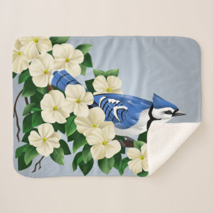 Cobertor Sherpa Jay azul entre flores do Dogwood