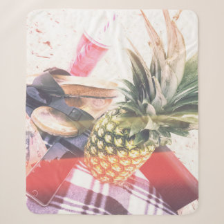 Cobertor Sherpa Pineapple beside phone and speaker