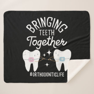 Cobertor Sherpa Trazendo os Dentes Junto - Ortodontista