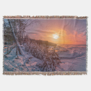 Cobertor Sol sobre a costa da neve