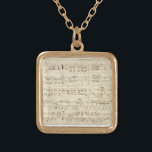 Colar Banhado A Ouro Folha de música em pergaminho manuscrita a tinta<br><div class="desc">Música antiga de folha antiga escrita à mão a tinta preta num pergaminho bege antigo com notas. Memórias de há muito tempo,  quando a música era escrita à mão a tinta. Notações e rabiscos ao lado dão um toque pessoal.</div>