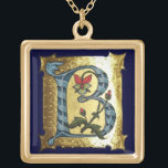COLAR BANHADO A OURO LETRA B AZUL DOURADA COM MONOGRAMA DE FLORES<br><div class="desc">Letra floral B medieval inicial sobre fundo dourado.</div>