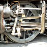 COLAR DE PRATA ESTERLINA COMBOIOS DE VAPOR<br><div class="desc">Um design fotográfico da roda de um trem a vapor.</div>
