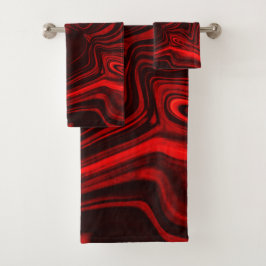 Conjunto De Toalhas Curvas claras e escuras sobre fundo escuro.