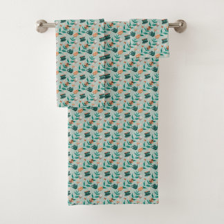 Conjunto De Toalhas Towels with a teal floral pattern hang 