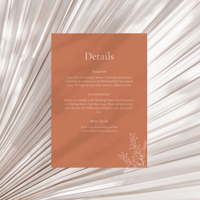 Convite Dark Terracotta Botanical Details Card (Dark Terracotta Botanical Details Card on a sunny neutral dry palm leaf.)