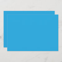 um fundo azul com um gato preto e branco