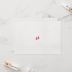 Convite um par de folhas vermelhas sobre fundo preto