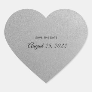 Coração prateado com adesivos de texto