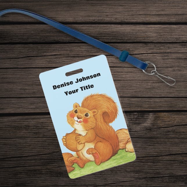 Crachá Esquilo Vermelho Comendo Nozes Sentado na Grama Cé (Cute red squirrel with stash of acorns and nuts in grass on blue ID plastic badge.)