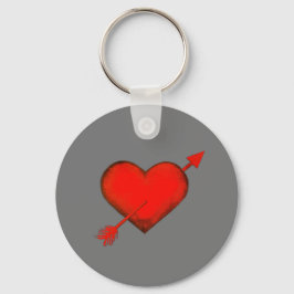 Cupido vermelho de seta na Chaveiro do botão da Ci