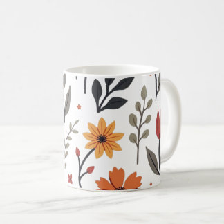 De Café É uma caneca decorada com flores e folhas.
