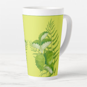 De Café Latte Formulários em verde numa caneca latina grande