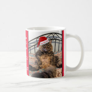 De Café O gato do papai noel obtem a caneca do leite e do