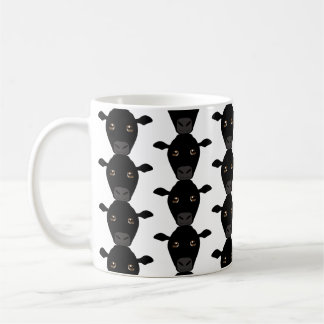 De Café Vacas negras na caneca