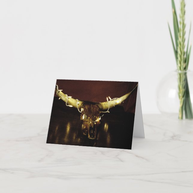 De Festividades O crânio do Natal ilumina o cartão (Frente)