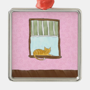 De Metal Gatinho amarelo em um ornamento da janela
