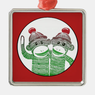De Metal Macacos da peúga com o ornamento vermelho do